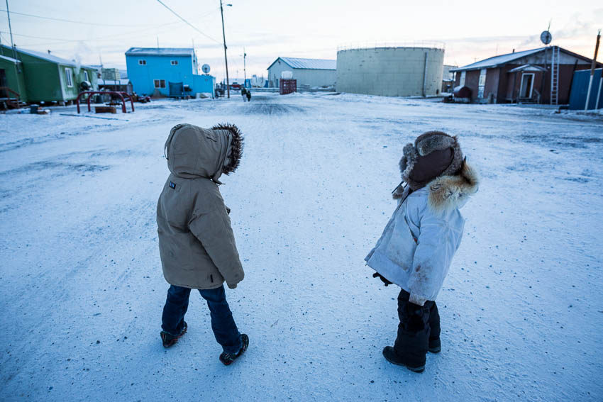 Kivalina kindergartners Damian Frankson, left, and Randy Swan walk home after school at -40 degrees