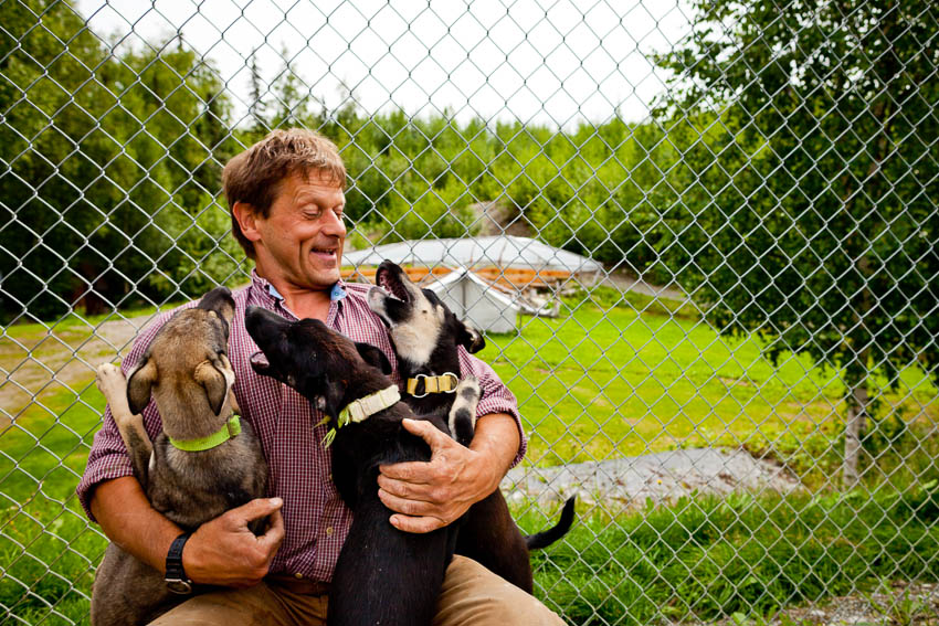 Iditarod record-holder Martin Buser with the "Palin Litter." Each dog is named for a member of Sarah Palin's family
